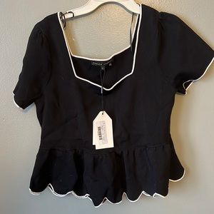 Peplum black top. With tags.